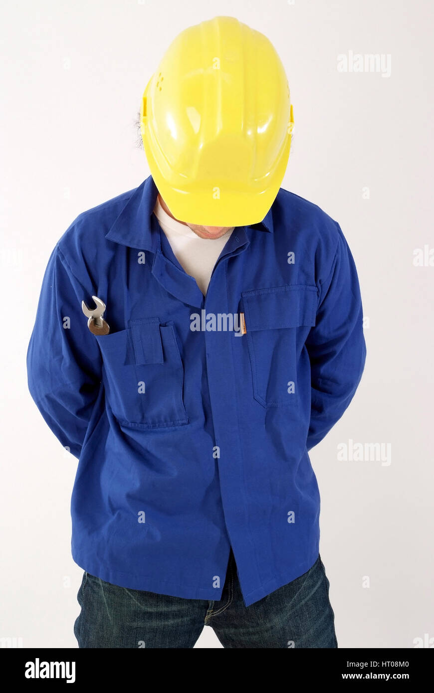 Bauarbeiter mit Blaumann und Bauhelm, Symbolbild Schwarzarbeiter - building worker Stock Photo