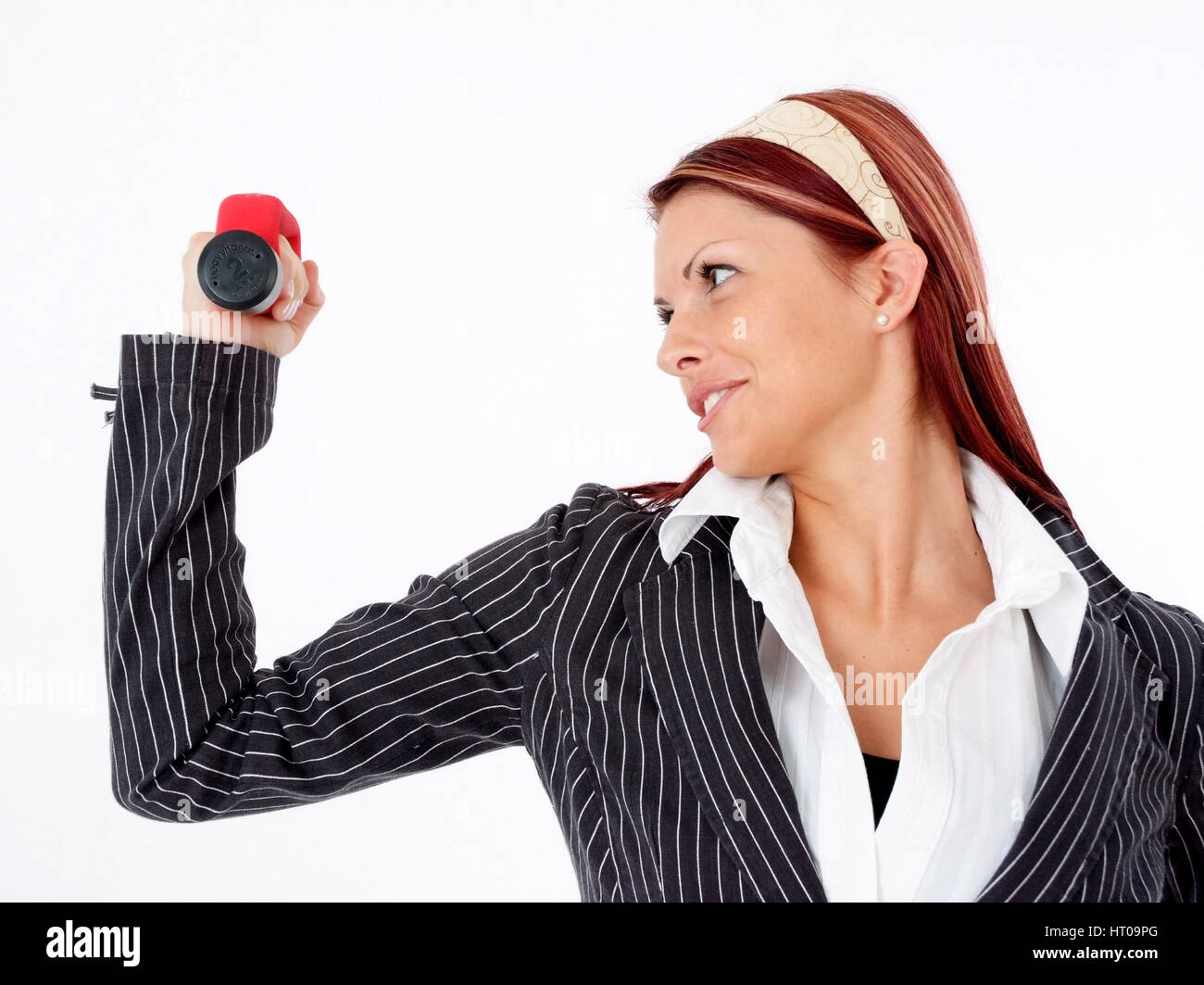 Geschoeaeftsfrau mit Hanteln, Powerfrau - business woman with dumbbells Stock Photo