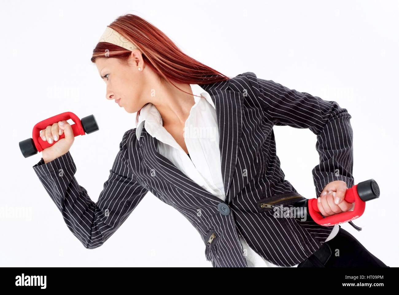 Geschoeaeftsfrau mit Hanteln, Powerfrau - business woman with dumbbells Stock Photo