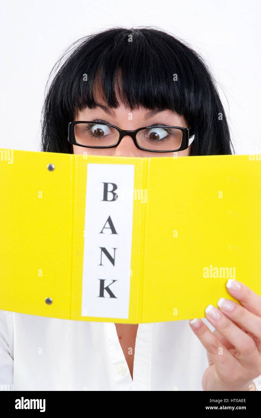 Junge, schockierte Frau mit Bankbelegen - shocked woman with bank statement Stock Photo