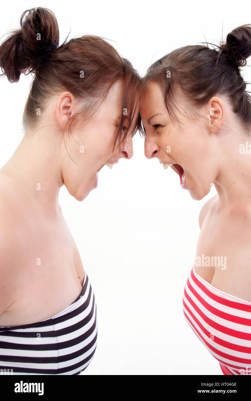 Zwillinge schreien sich an - twins screaming each other Stock Photo