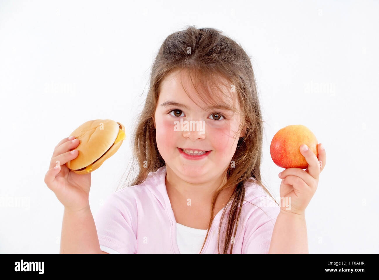 Molliges M?dchen mit Burger und Apfel - chubby girl with burger and apple Stock Photo