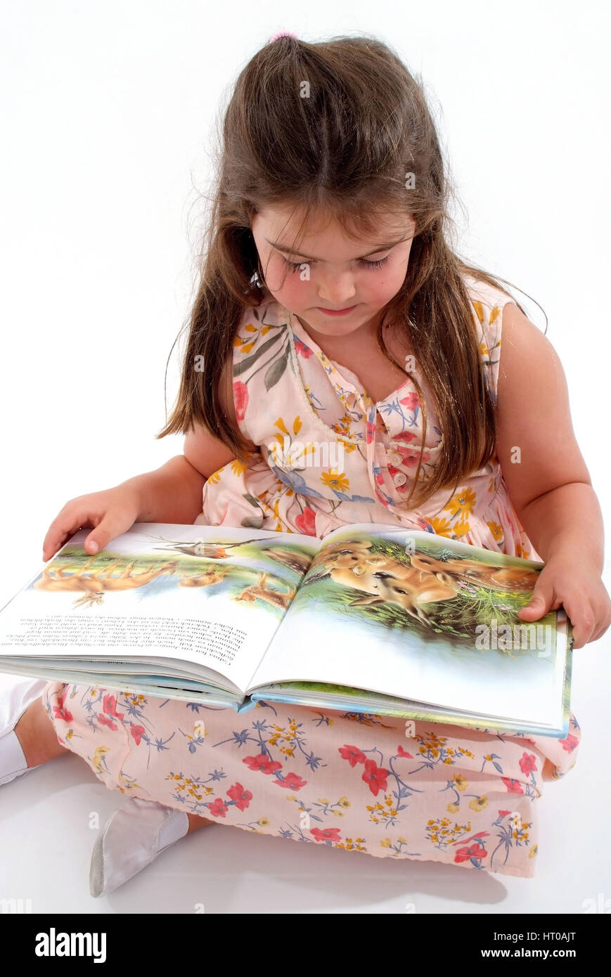 M?dchen mit Kinderbuch - girl with children's book Stock Photo