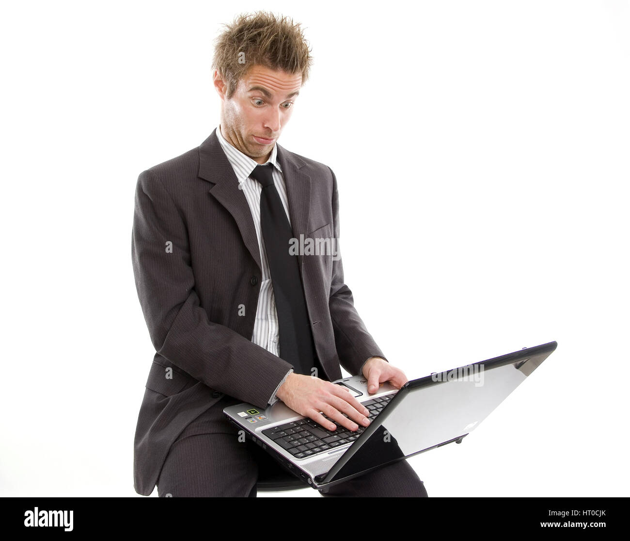 ‹berforderter Gesch‰ftsmann arbeitet am Laptop - overstrained business man using laptop Stock Photo