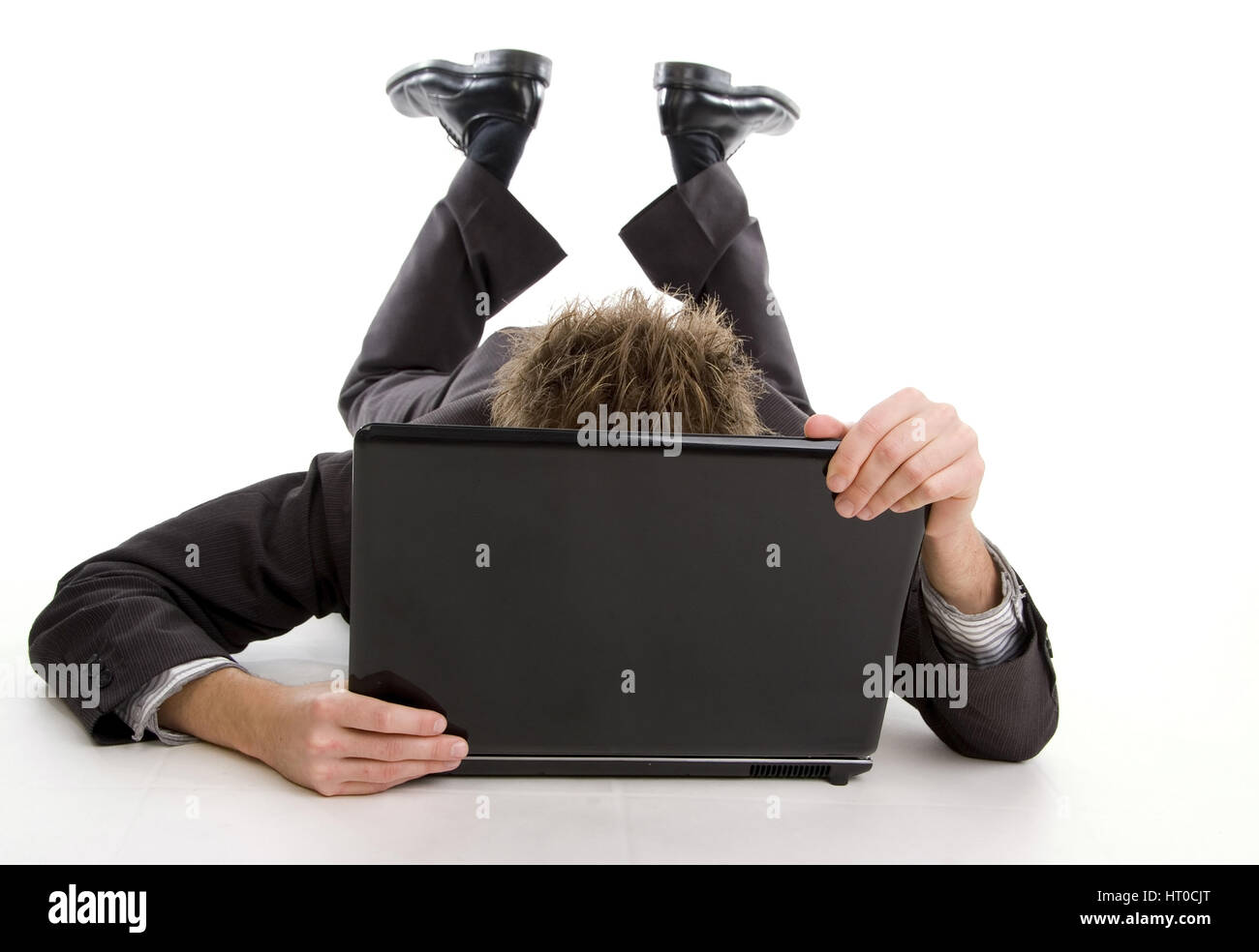 Mann versteckt sich hinter Notebook - man with laptop Stock Photo