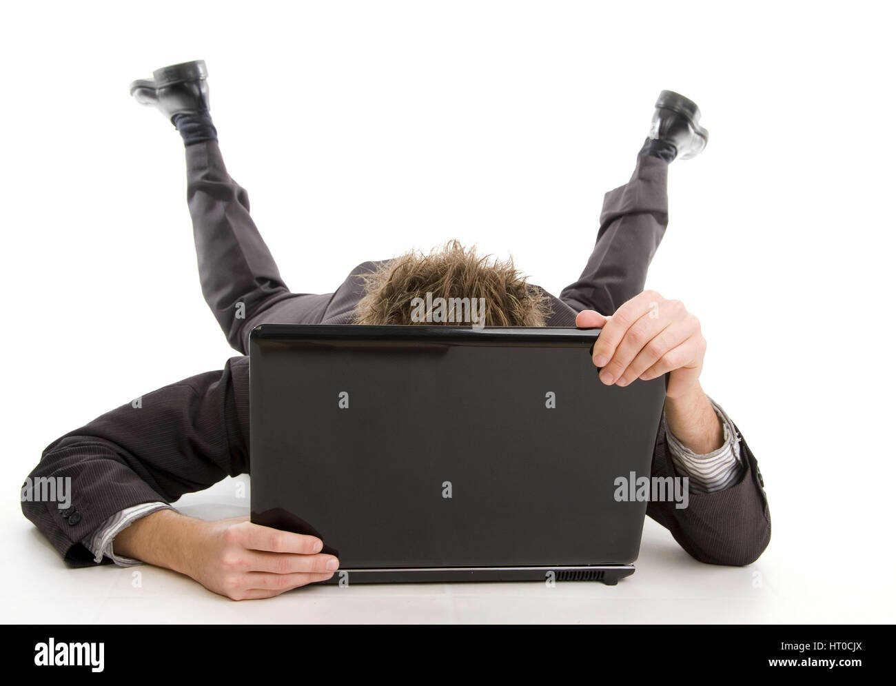Mann versteckt sich hinter Notebook - man with laptop Stock Photo