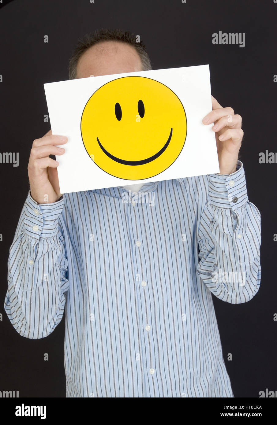 Mann mit lachendem Smileygesicht - man with laughing smiley face Stock Photo