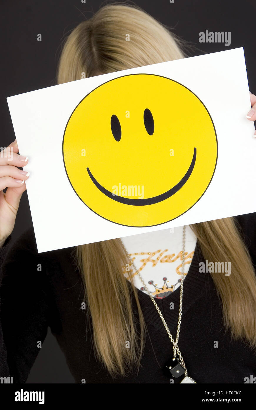 M‰dchen mit lachendem Smileygesicht - girl with laughing smiley face Stock Photo