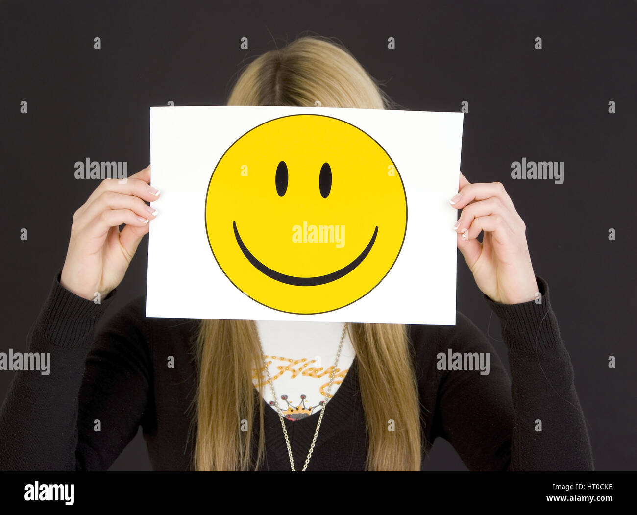 M‰dchen mit lachendem Smileygesicht - girl with laughing smiley face Stock Photo