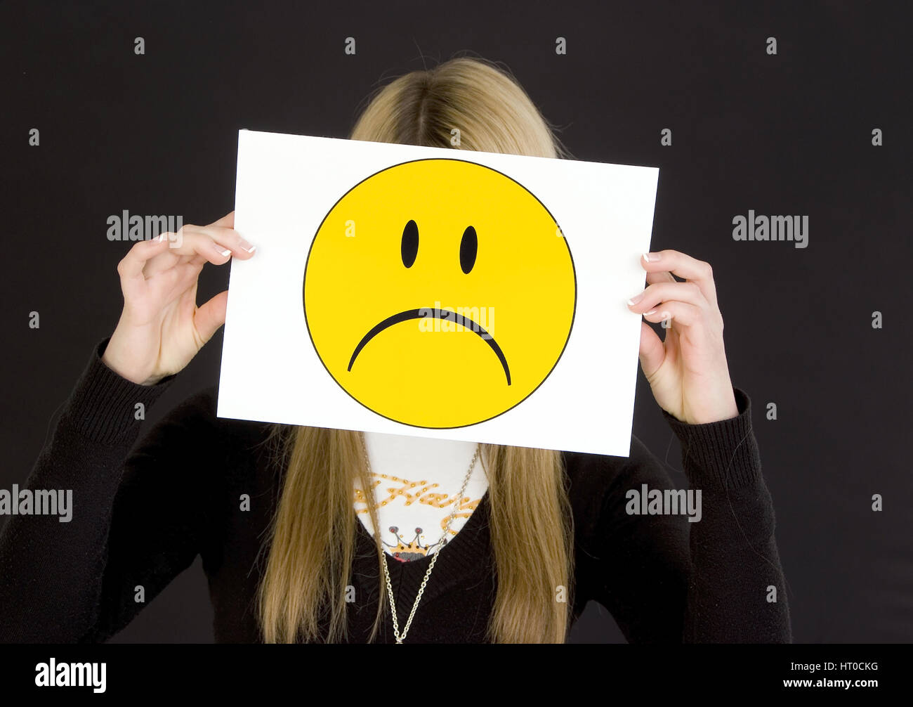 M‰dchen mit traurigem Smileygesicht - girl with sad smiley face Stock Photo