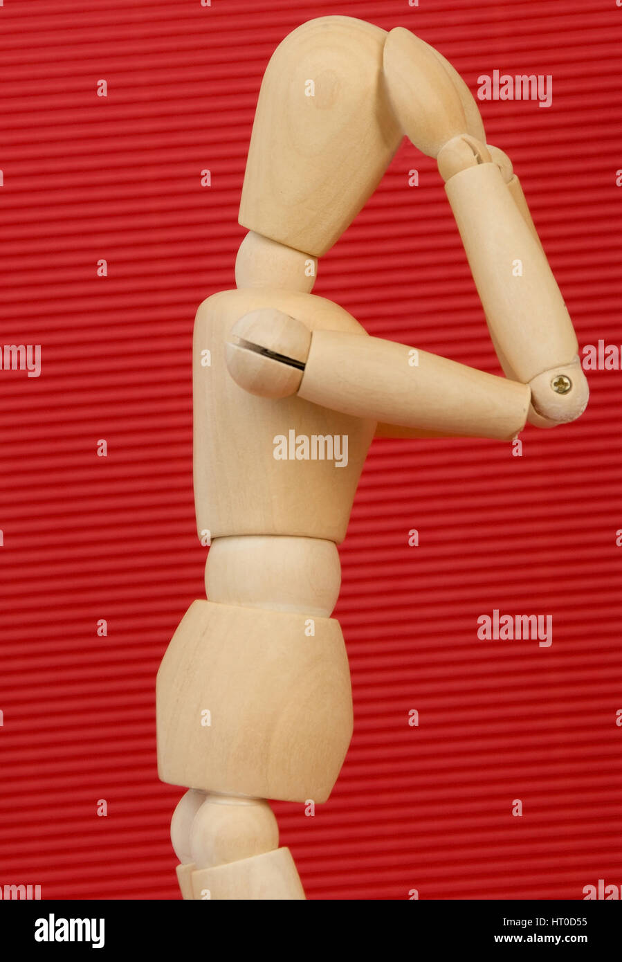 Gliederpuppe greift sich an den Kopf - jointed doll with headache Stock Photo