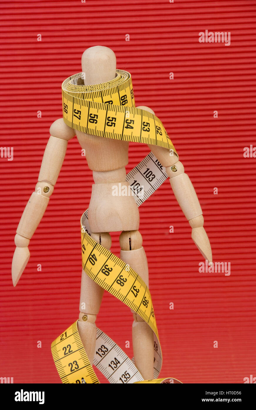 Gliederpuppe mit Ma?band umwickelt - jointed doll wound in a measuring tape Stock Photo