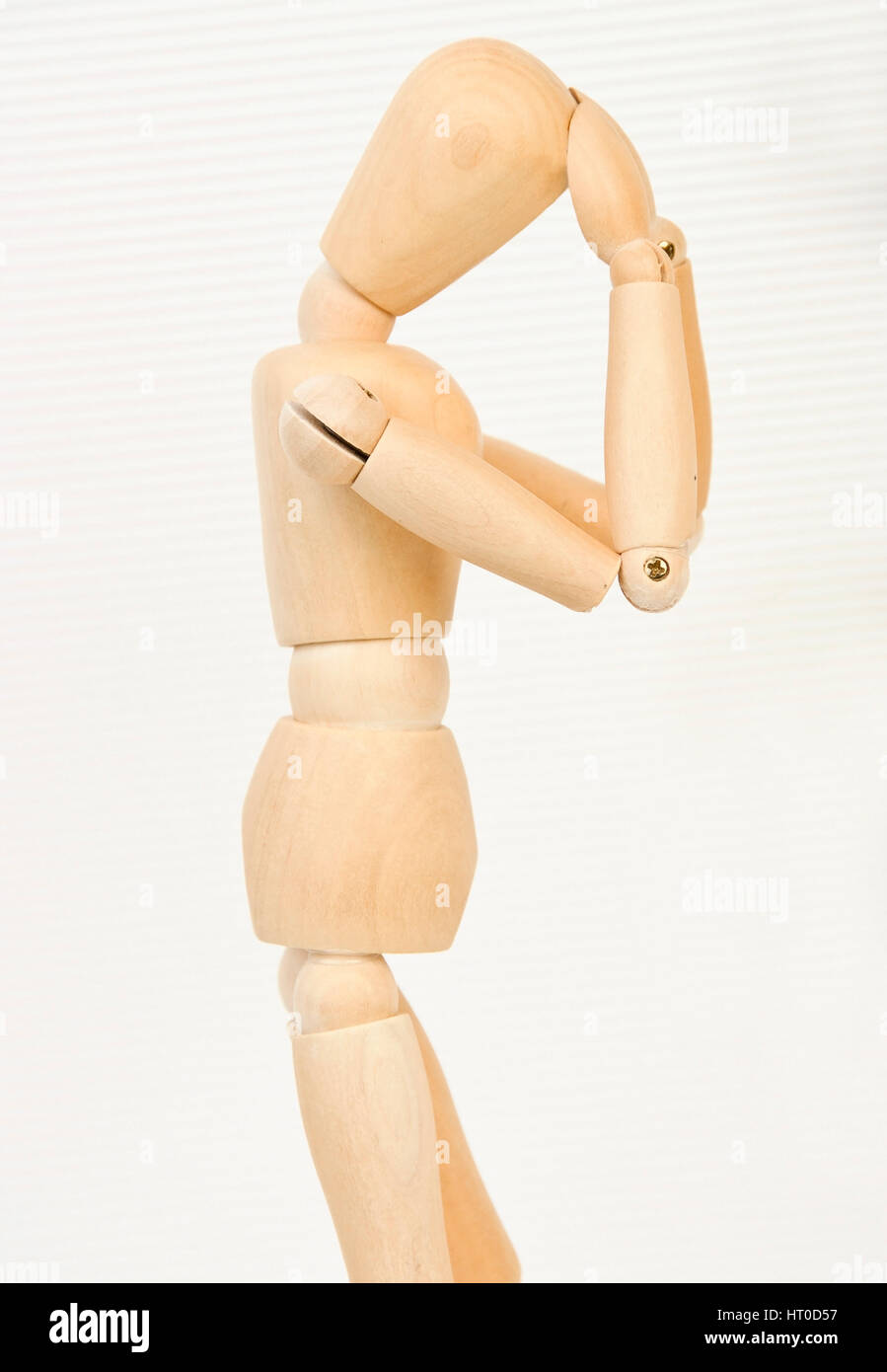 Gliederpuppe greift sich an den Kopf - jointed doll with headache Stock Photo