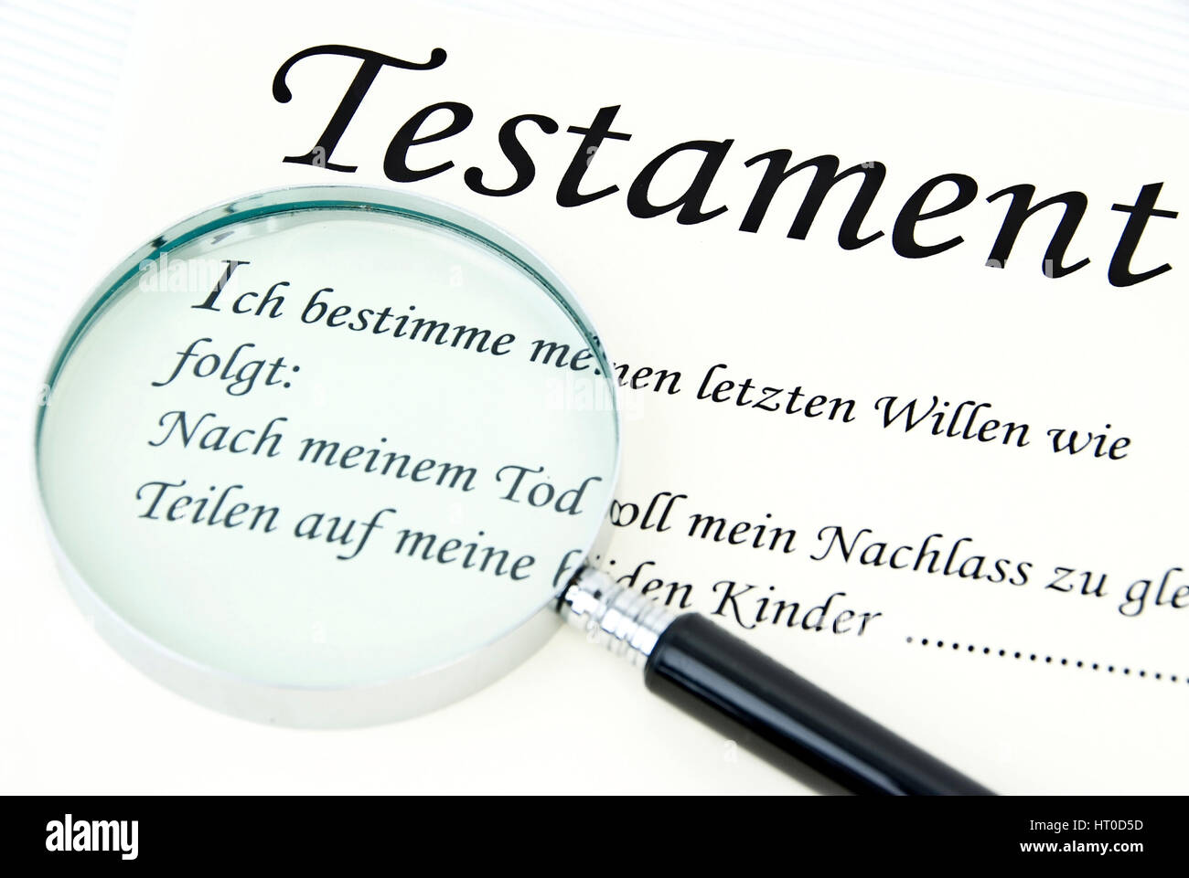 Symbolbild Testament unter der Lupe - symbolic for testament under loupe Stock Photo