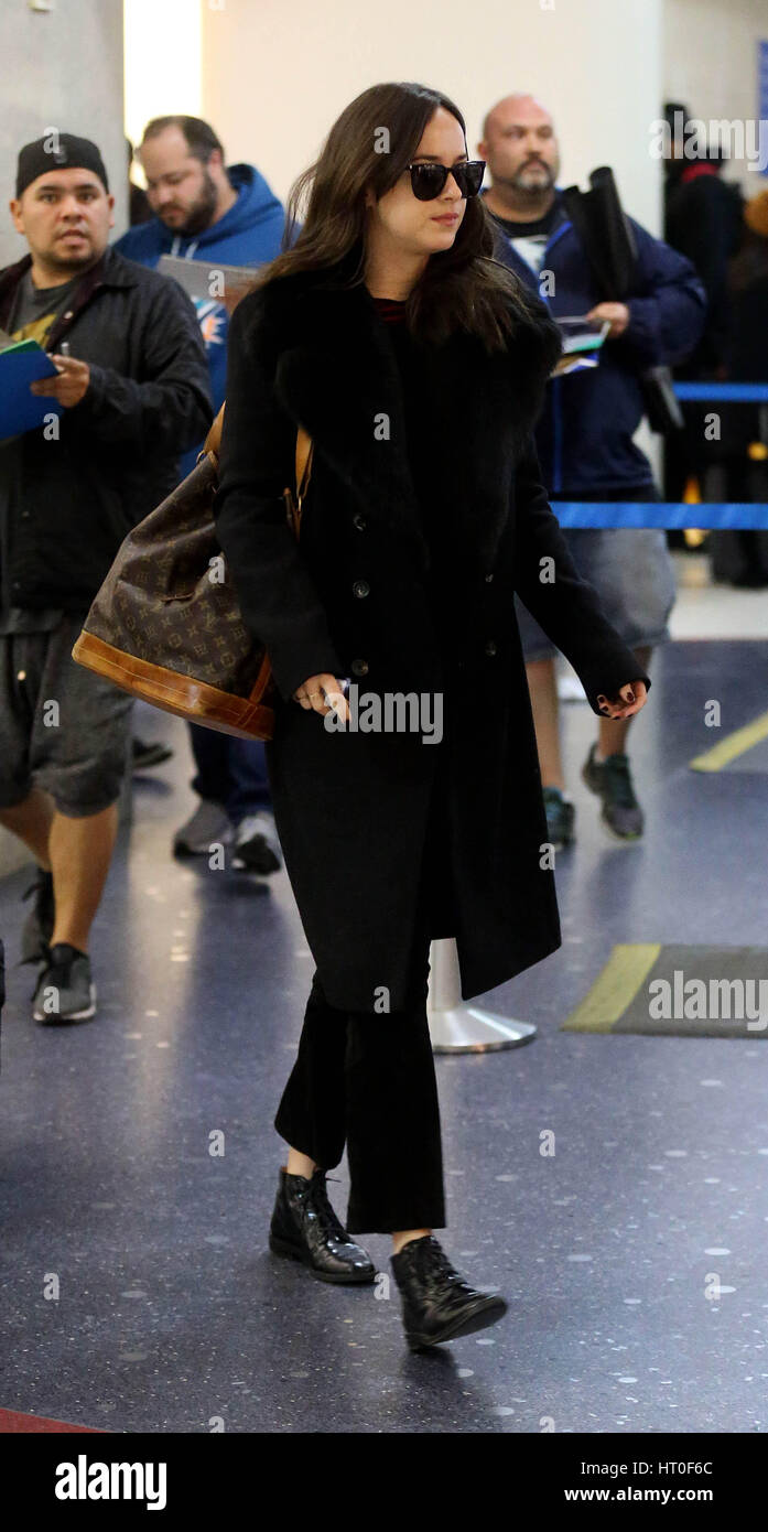 Dakota Johnson at Los Angeles International Airport (LAX) carrying a Louis Vuitton handbag  Featuring: Dakota Johnson Where: Los Angeles, California, United States When: 02 Feb 2017 Stock Photo