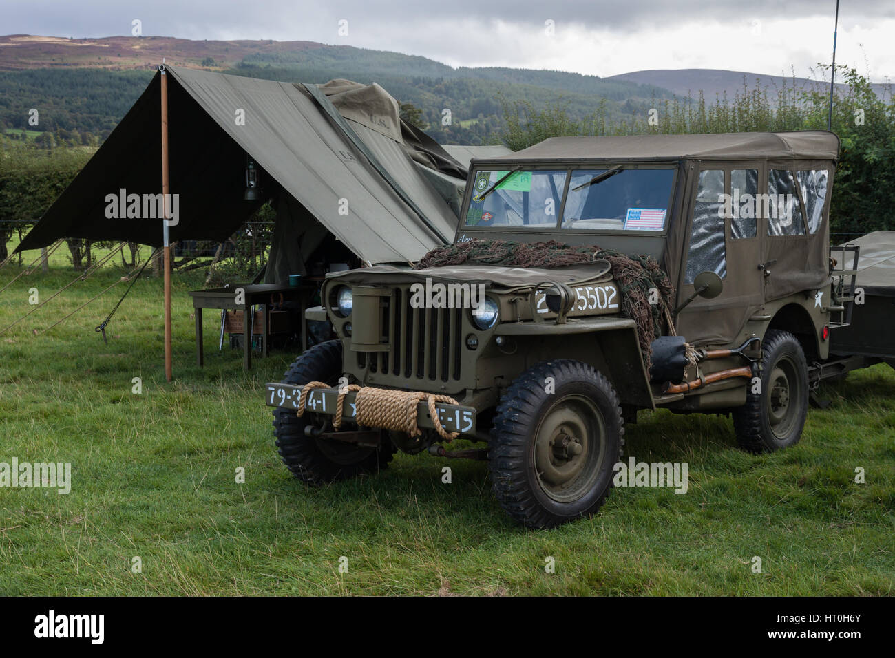 Restored Willys Jeep and American miltary tents in a field at Rhug North Wales Stock Photo