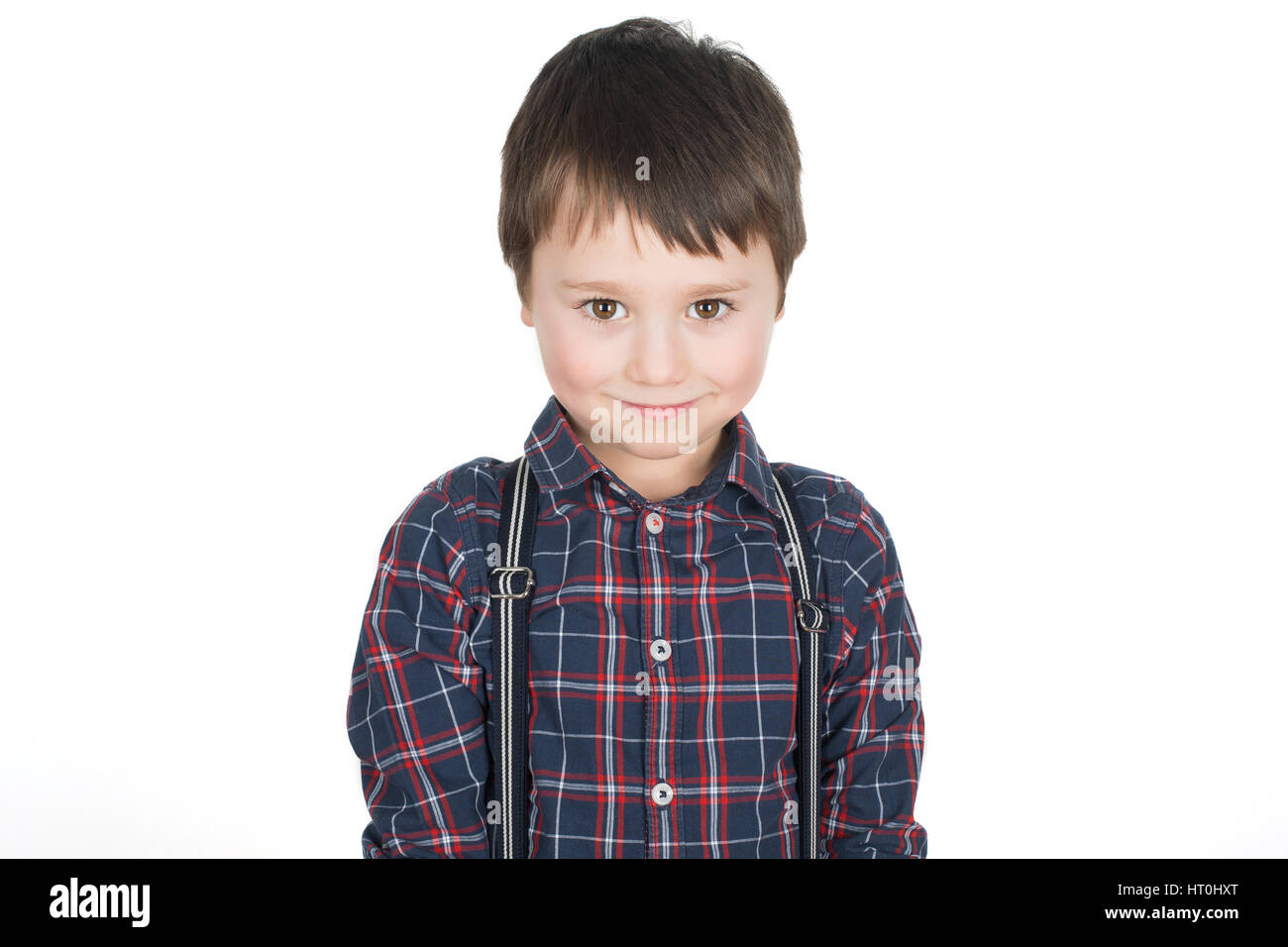Happy cheeky little boy smiling. Isolated on a white background. Stock Photo