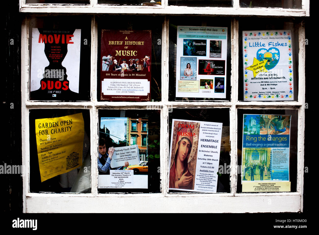 Shop window advertising community events & activities, Wells-next-the-sea, England. Stock Photo