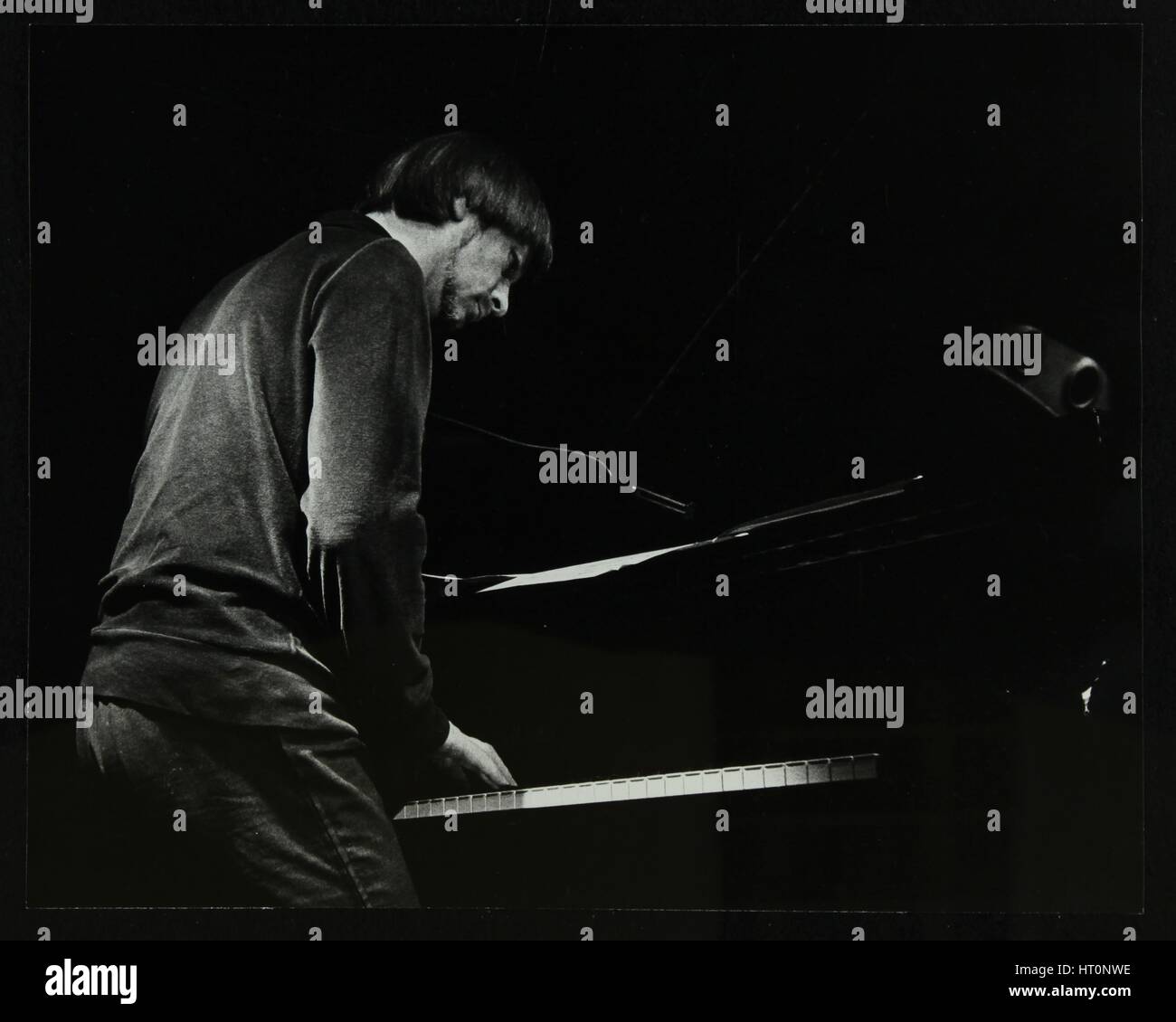 Michael Garrick on the piano at The Stables, Wavendon, Buckinghamshire