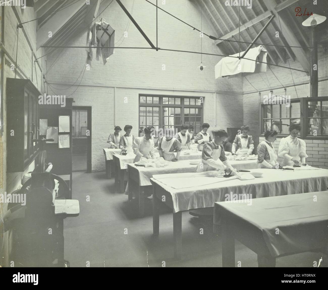 The ironing room, Battersea Polytechnic, London, 1907. Artist: Unknown. Stock Photo