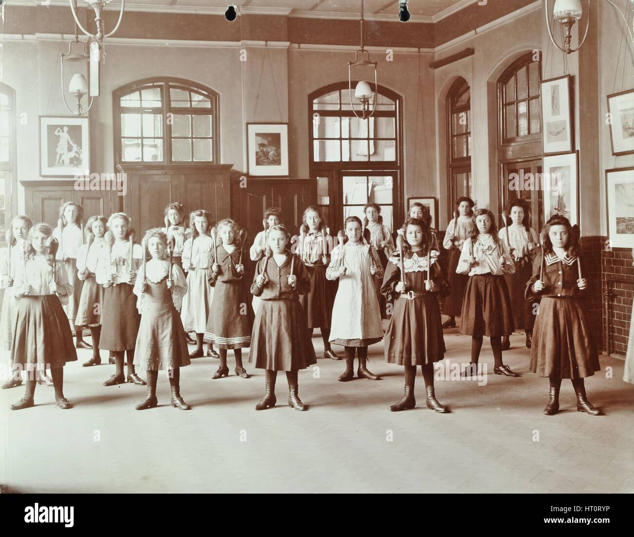 Girls holding Indian clubs, Cromer Street School/ Argyle School, St Pancras, London, 1906. Artist: Unknown. Stock Photo
