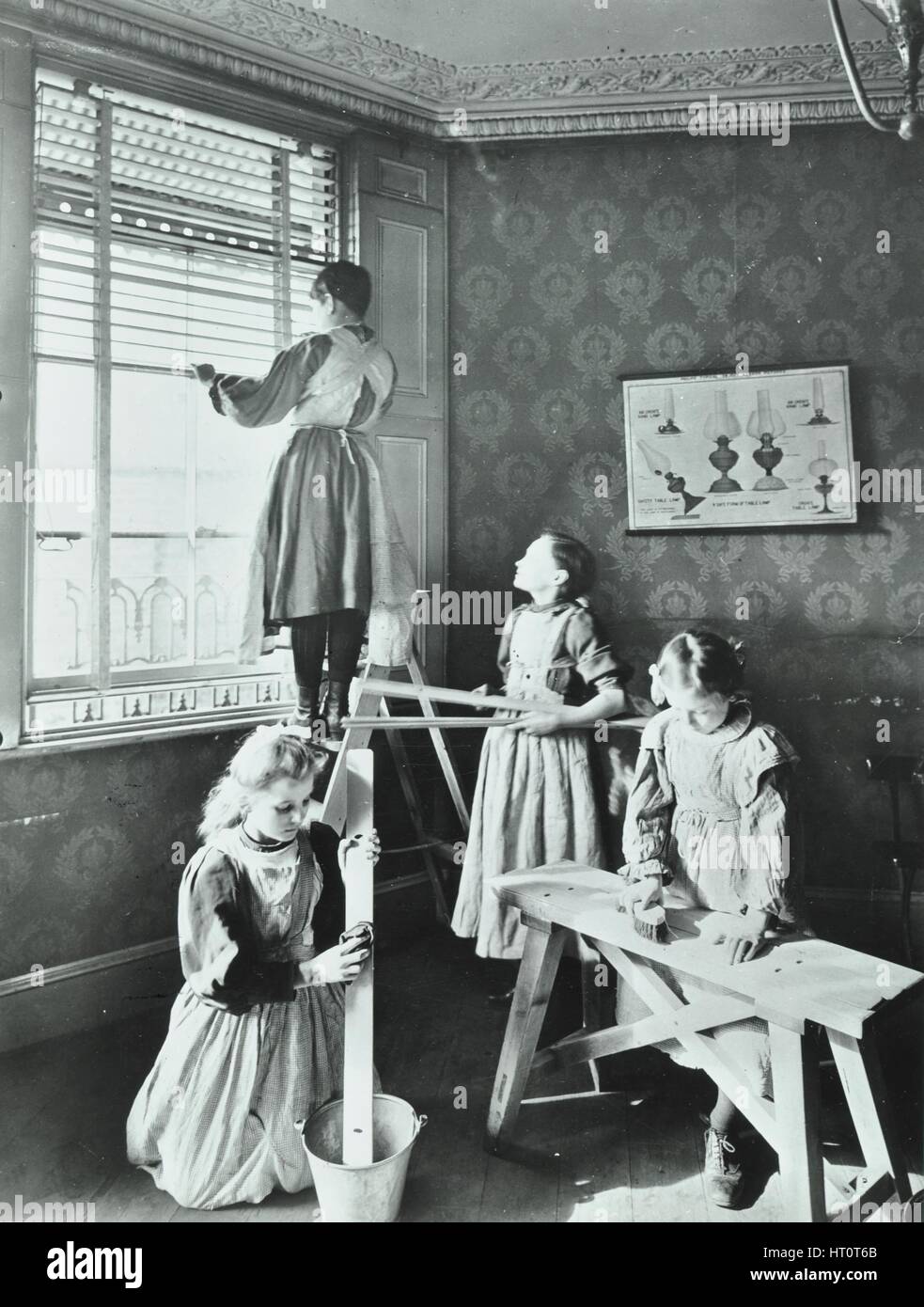 Housewifery lesson, Dulwich Hamlet School, Dulwich Village, London, 1908. Artist: Unknown. Stock Photo