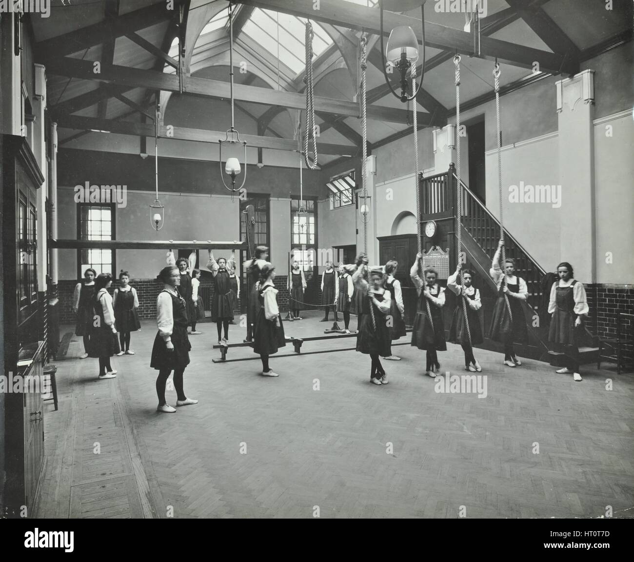 Girls in the gymnasium, Fulham County Secondary School, London, 1908. Artist: Unknown. Stock Photo