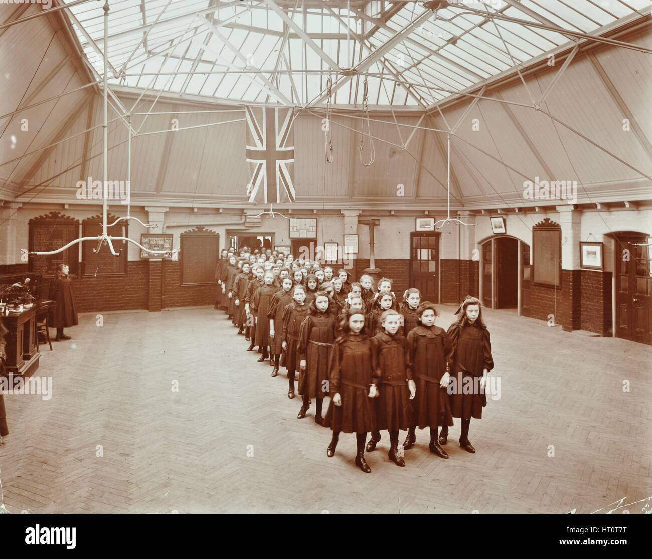 Girls returning from play, Thomas Street Girls School, Limehouse, Stepney, London, 1908. Artist: Unknown. Stock Photo