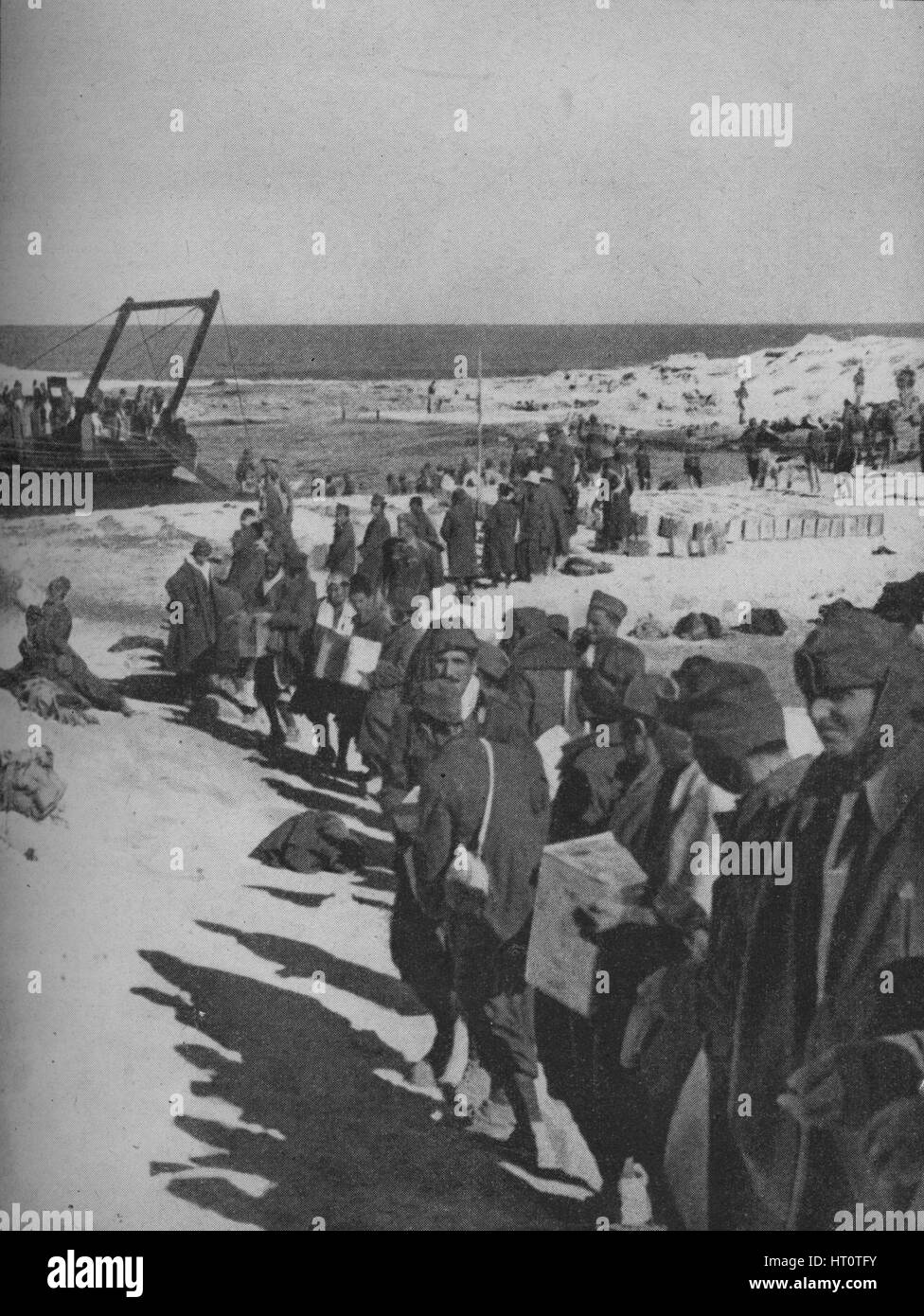 Italian prisoners captured by the British assisting in the loading of a ...