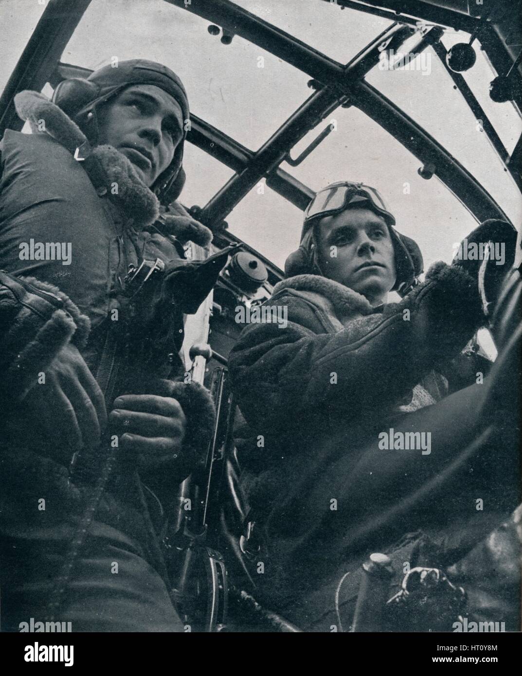 RAF bomber pilot and second pilot, 1941. Artist: Unknown. Stock Photo