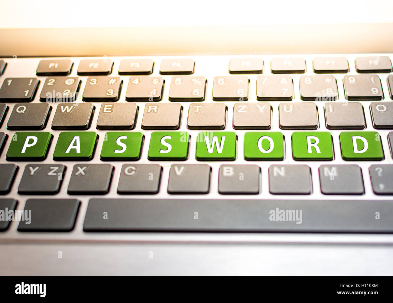 Keyboard of computer or laptop with green sign password Stock Photo