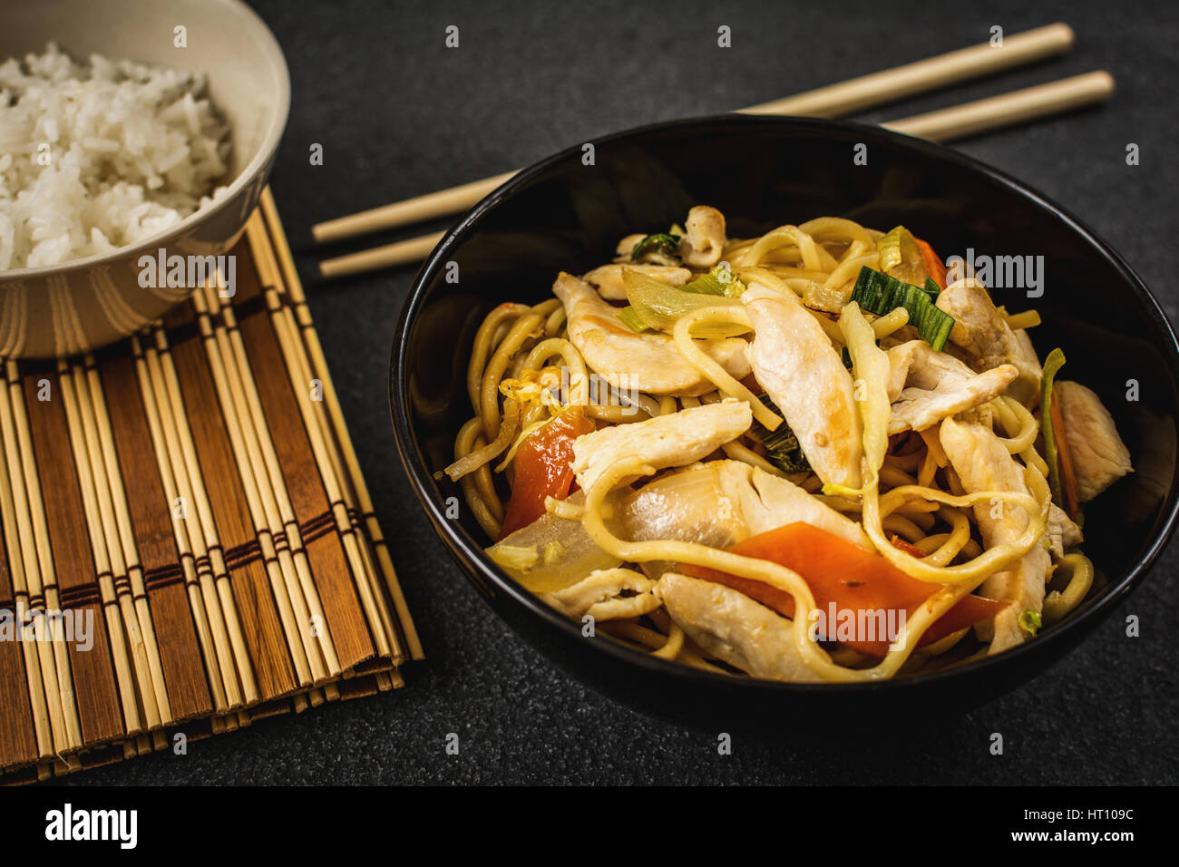 Asian or chinese noodles with chicken noodles and vegetables Stock