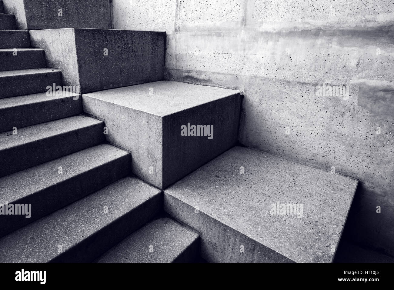 Urban concrete staircase, abstract architectural background, minimalistic lines and shapes with light and shadow Stock Photo
