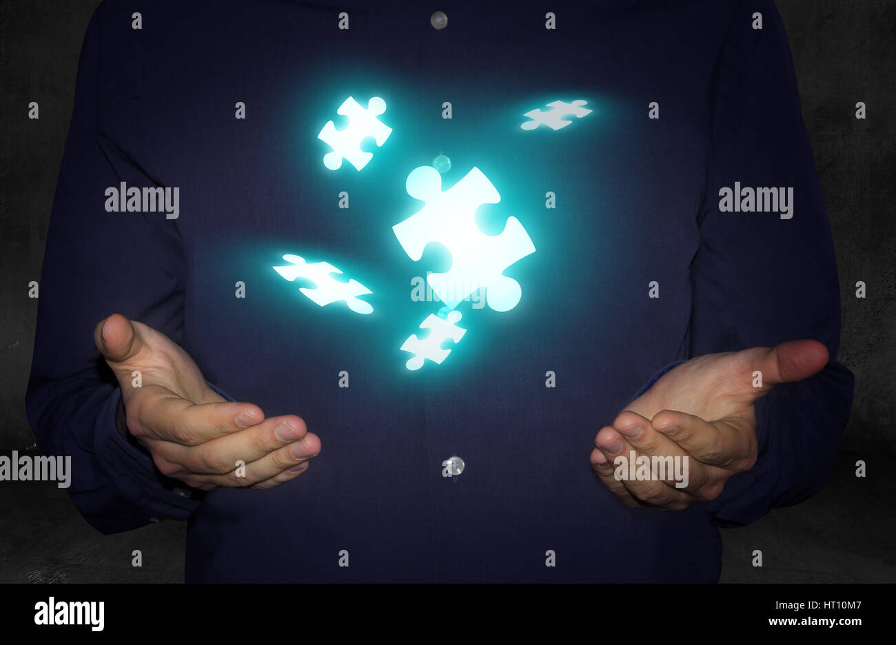 businessman hands with levitating puzzle pieces Stock Photo