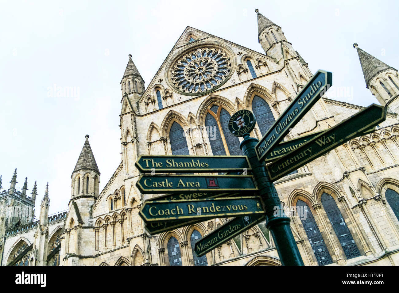 York minster building behind tourist directions sign York city centre minster facade architecture exterior Stock Photo