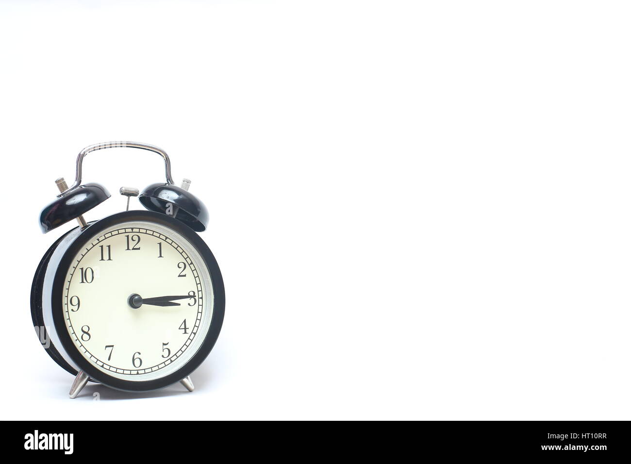 Retro alarm clock isolated on white background Stock Photo - Alamy