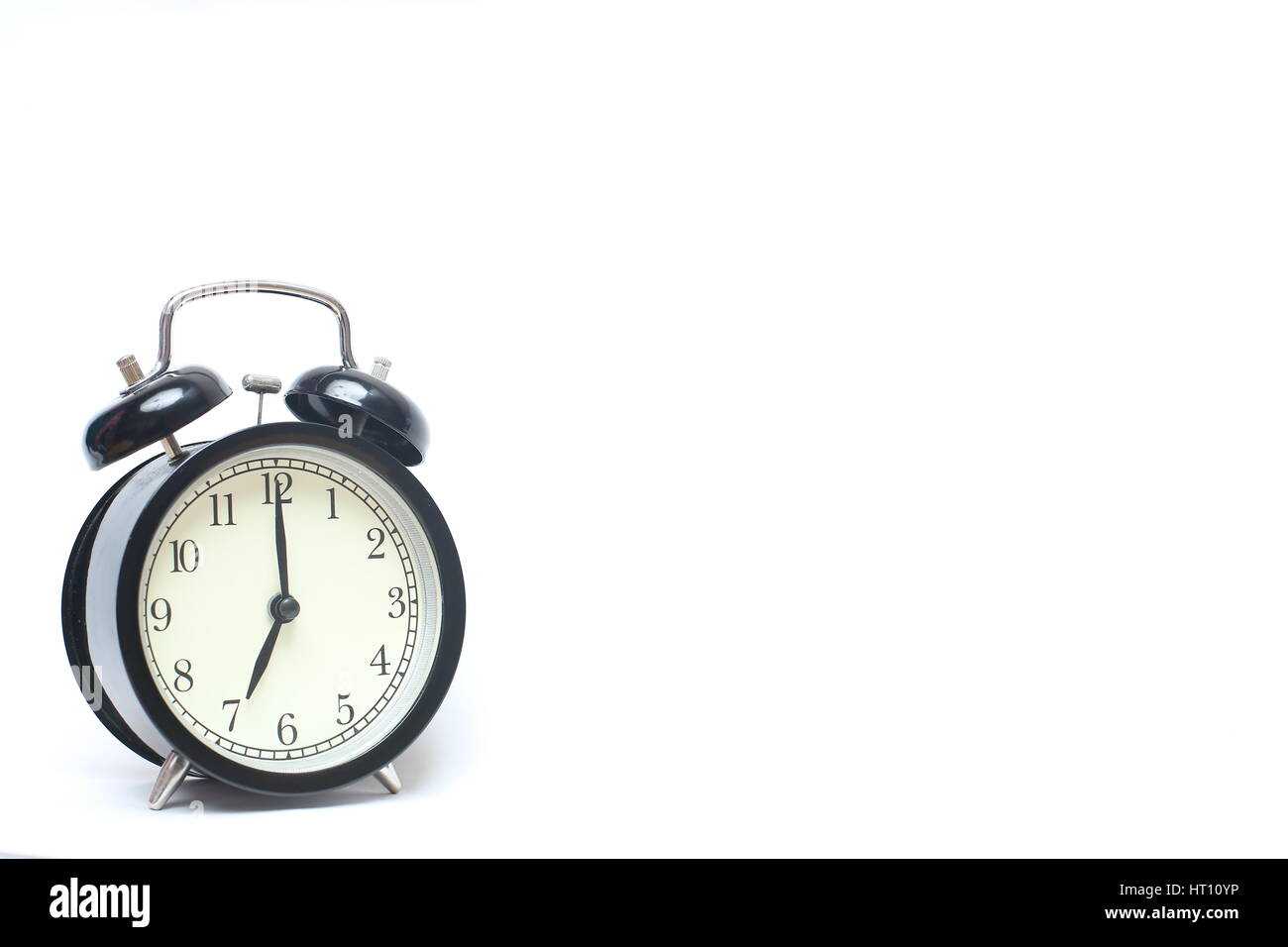 Retro alarm clock isolated on white background Stock Photo - Alamy