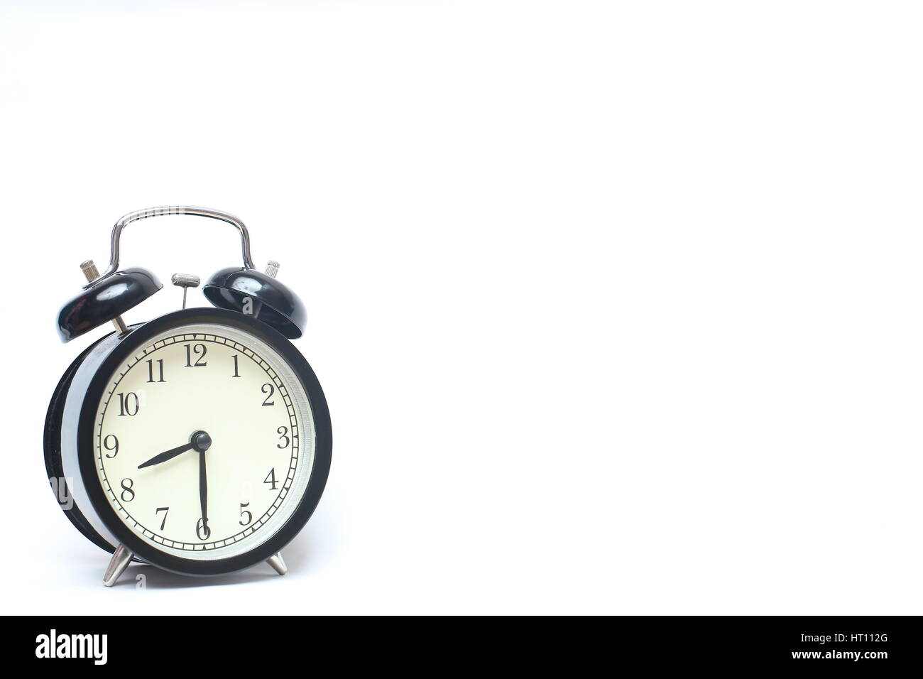 Retro alarm clock isolated on white background Stock Photo - Alamy
