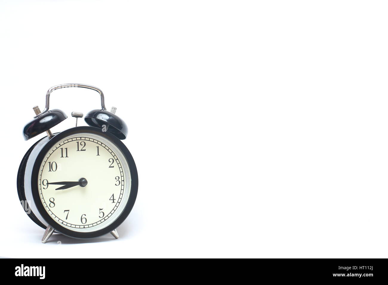Retro alarm clock isolated on white background Stock Photo - Alamy