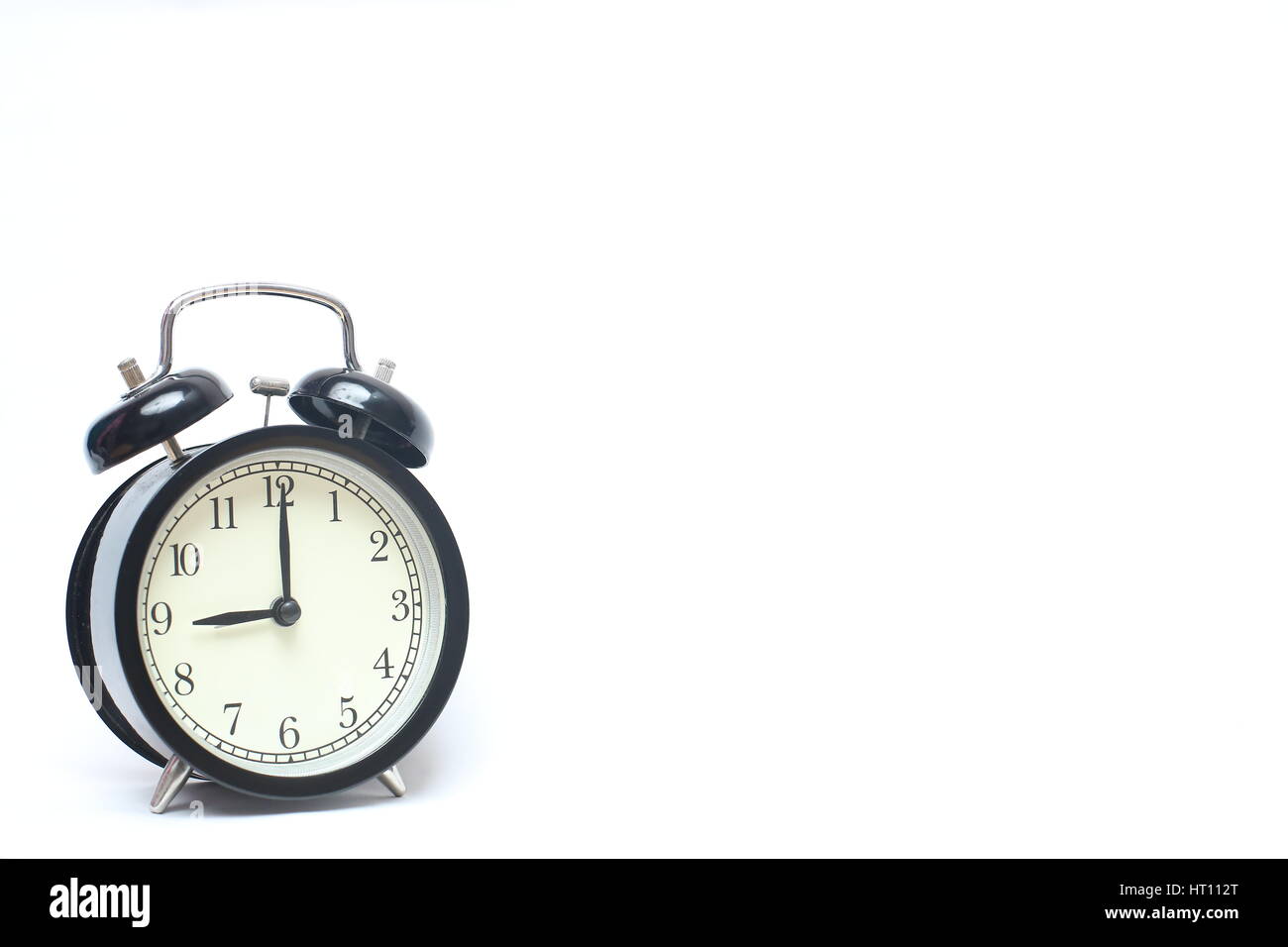 Retro alarm clock isolated on white background Stock Photo - Alamy