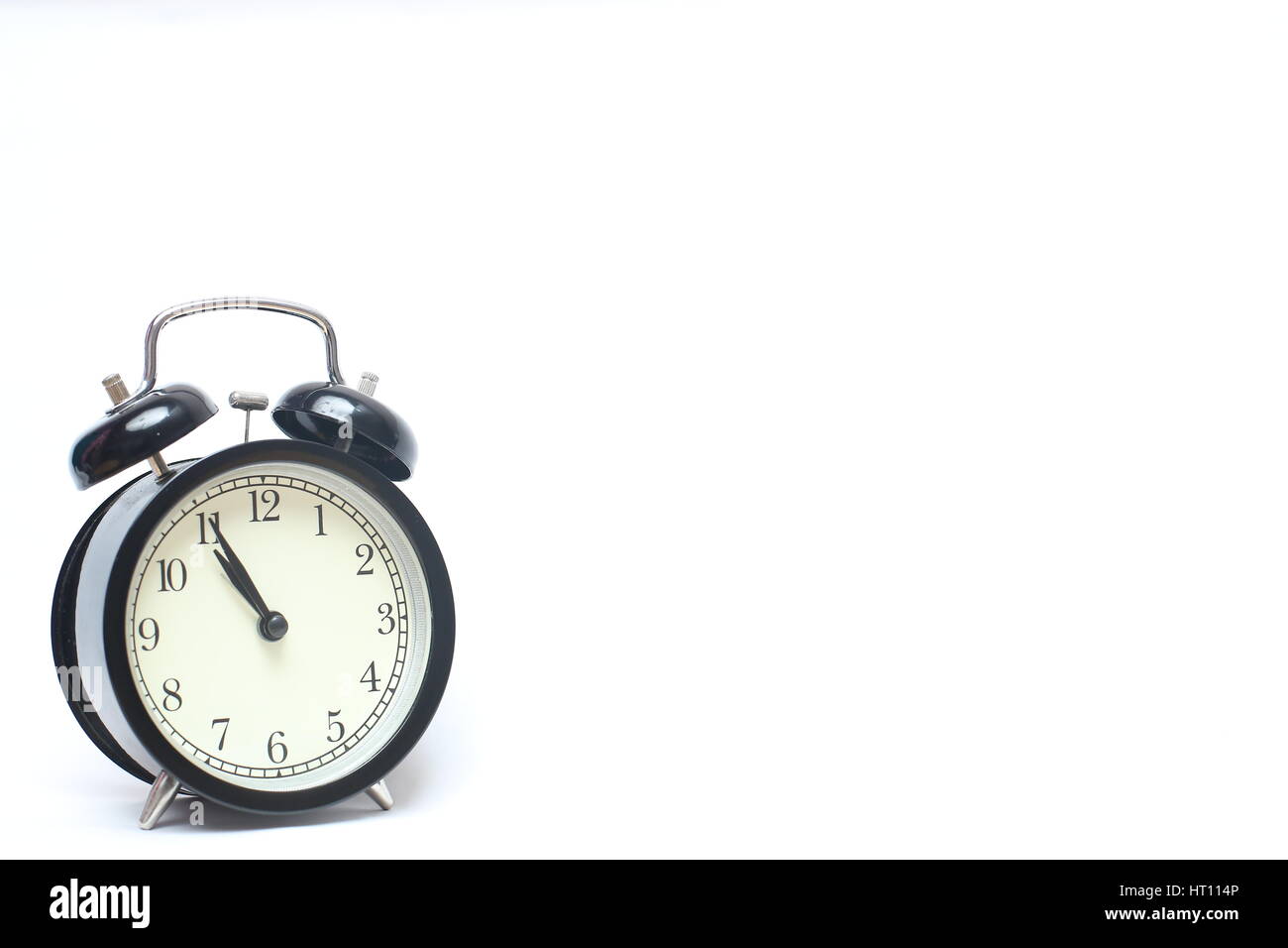 Retro alarm clock isolated on white background Stock Photo - Alamy