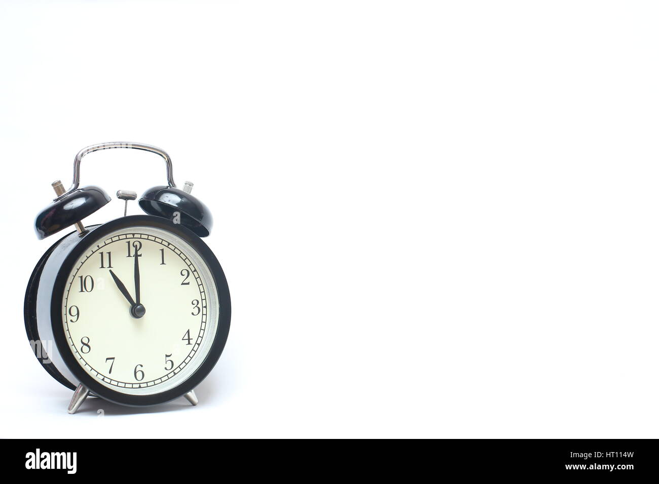 Retro alarm clock isolated on white background Stock Photo - Alamy