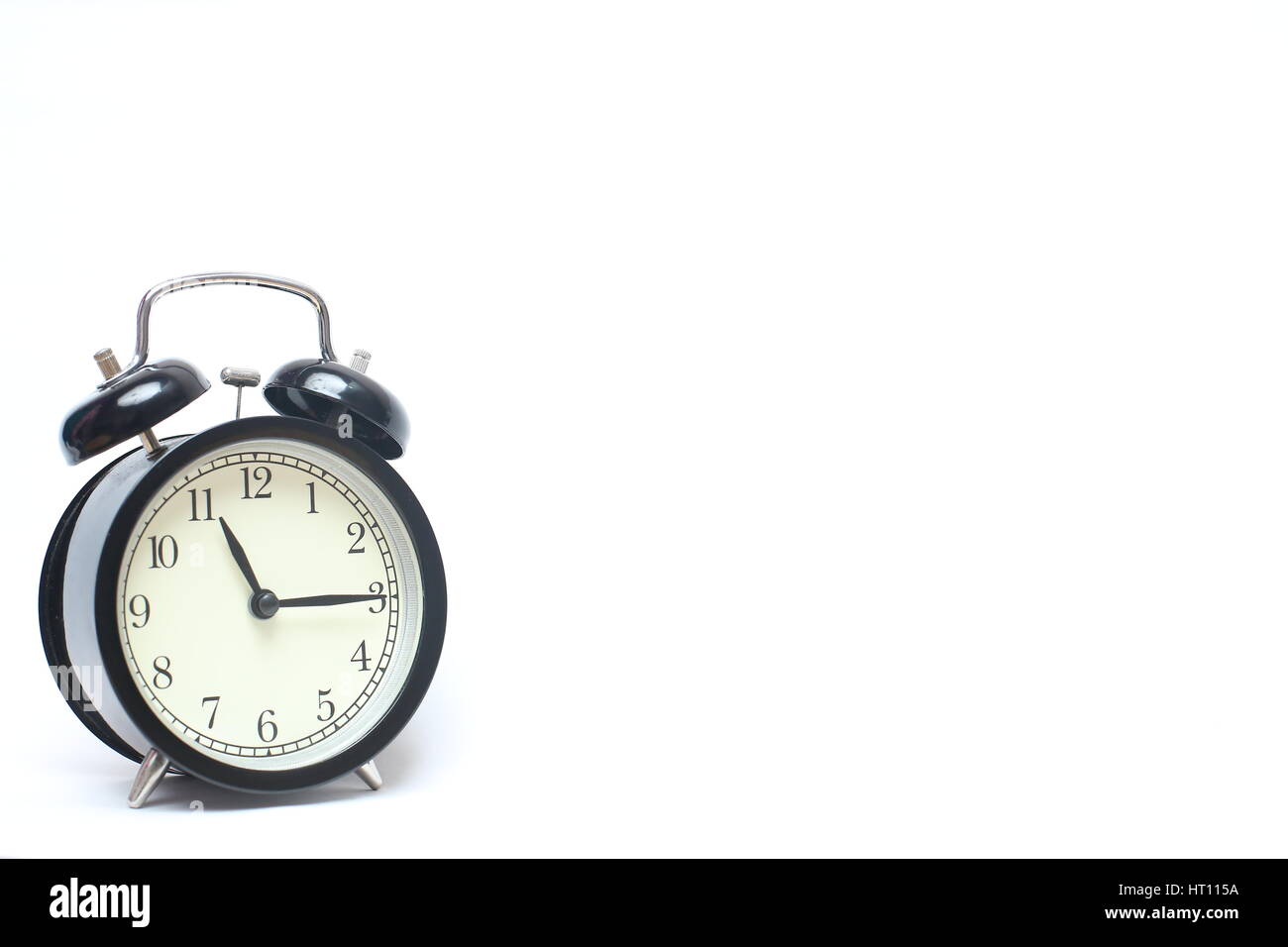 Retro alarm clock isolated on white background Stock Photo - Alamy