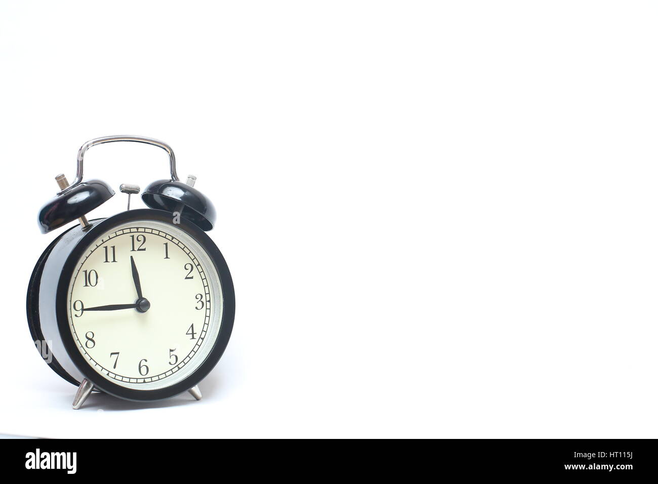 Retro alarm clock isolated on white background Stock Photo - Alamy