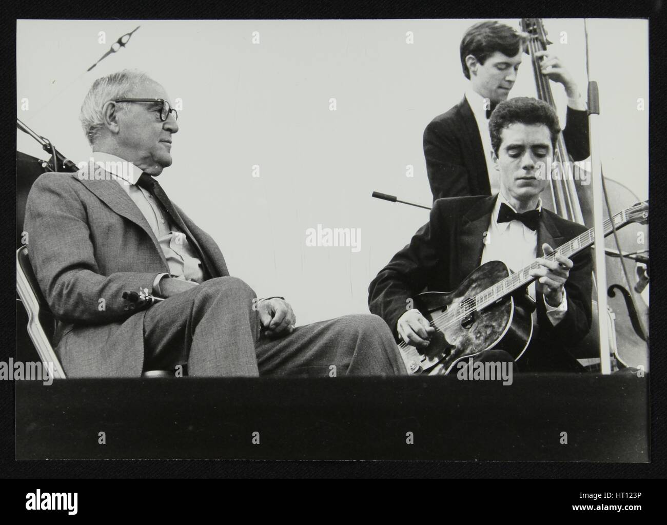 Benny Goodman watching Phil Flanigan and Chris Flory, Knebworth, Hertfordshire, 1982. Artist: Denis Williams Stock Photo