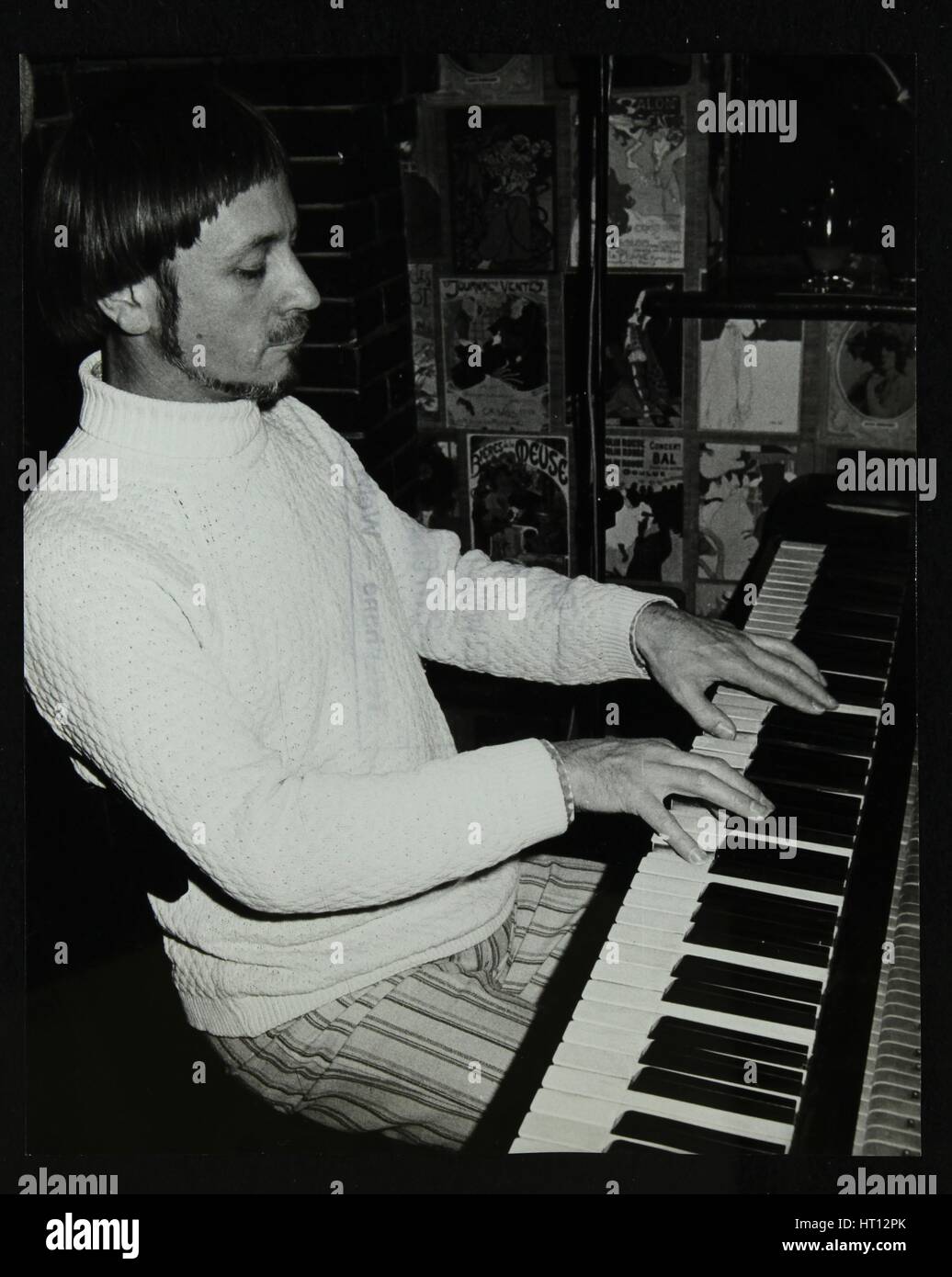 Michael Garrick playing the piano at The Bell, Codicote, Hertfordshire