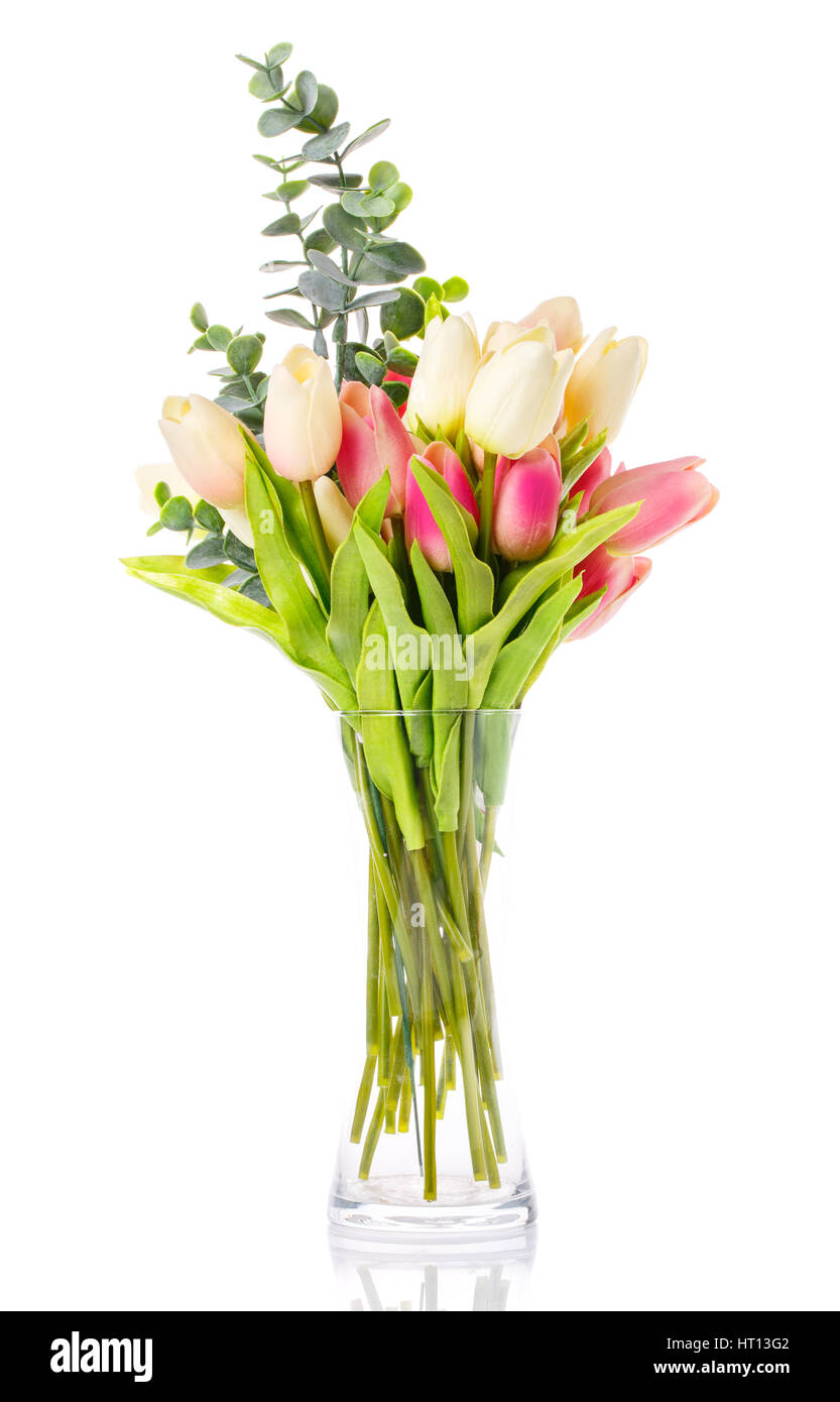 bouquet of tulips in a glass vase on a white background Stock Photo - Alamy