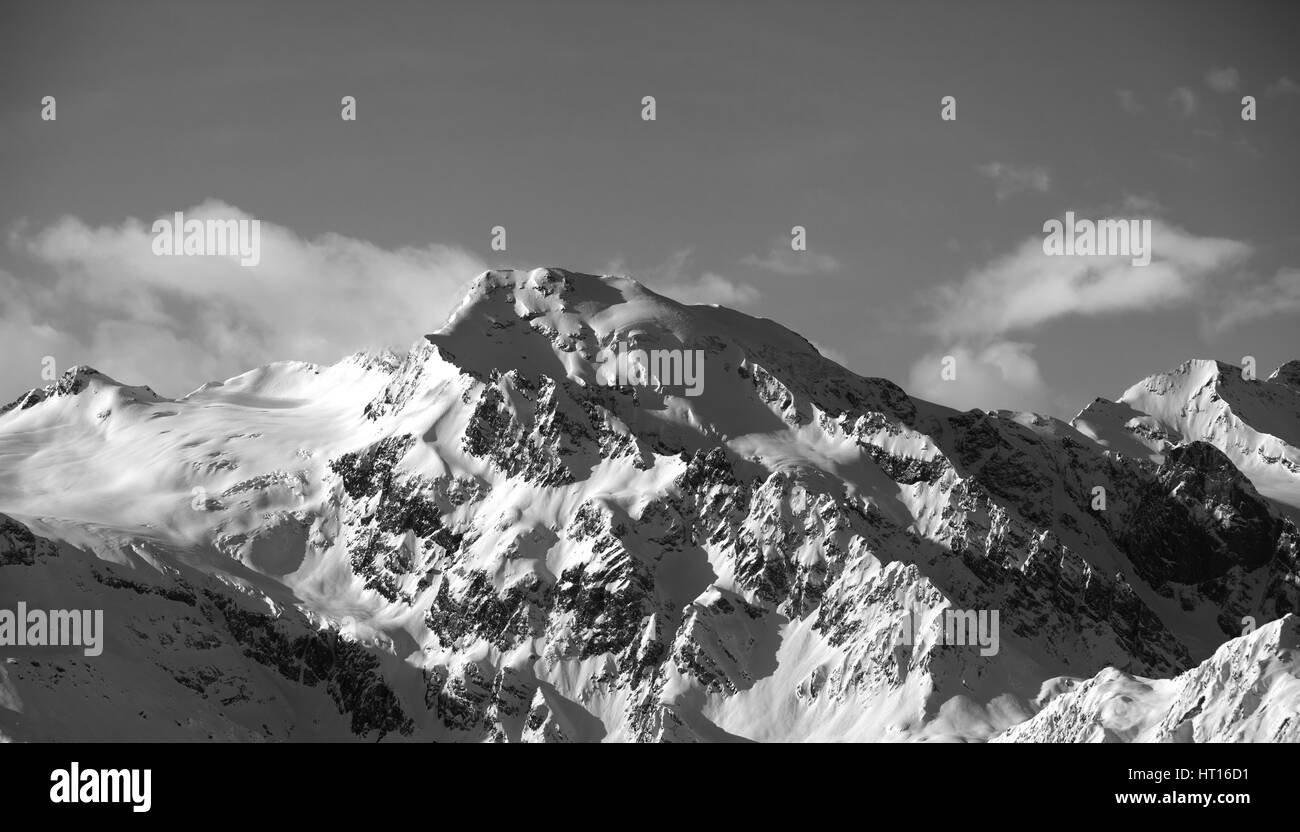 Black and white view on snowy mountains at sun day. Caucasus Mountains. Svaneti region of Georgia. Stock Photo