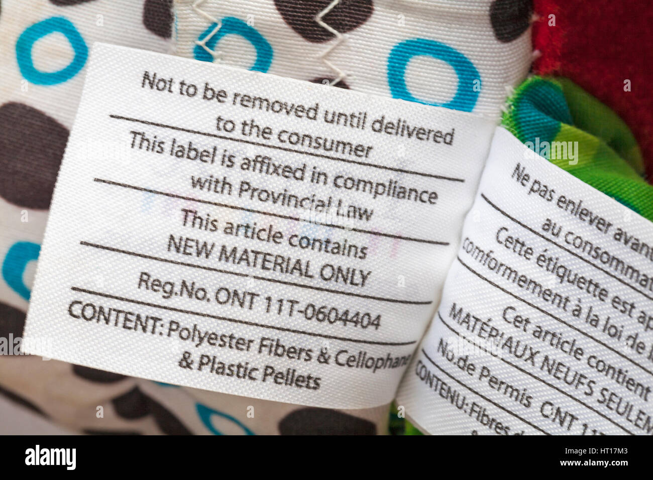 Not to be removed until delivered to the consumer this label is affixed in compliance with Provincial Law, info on label on Lamaze Trotter the pony toy Stock Photo