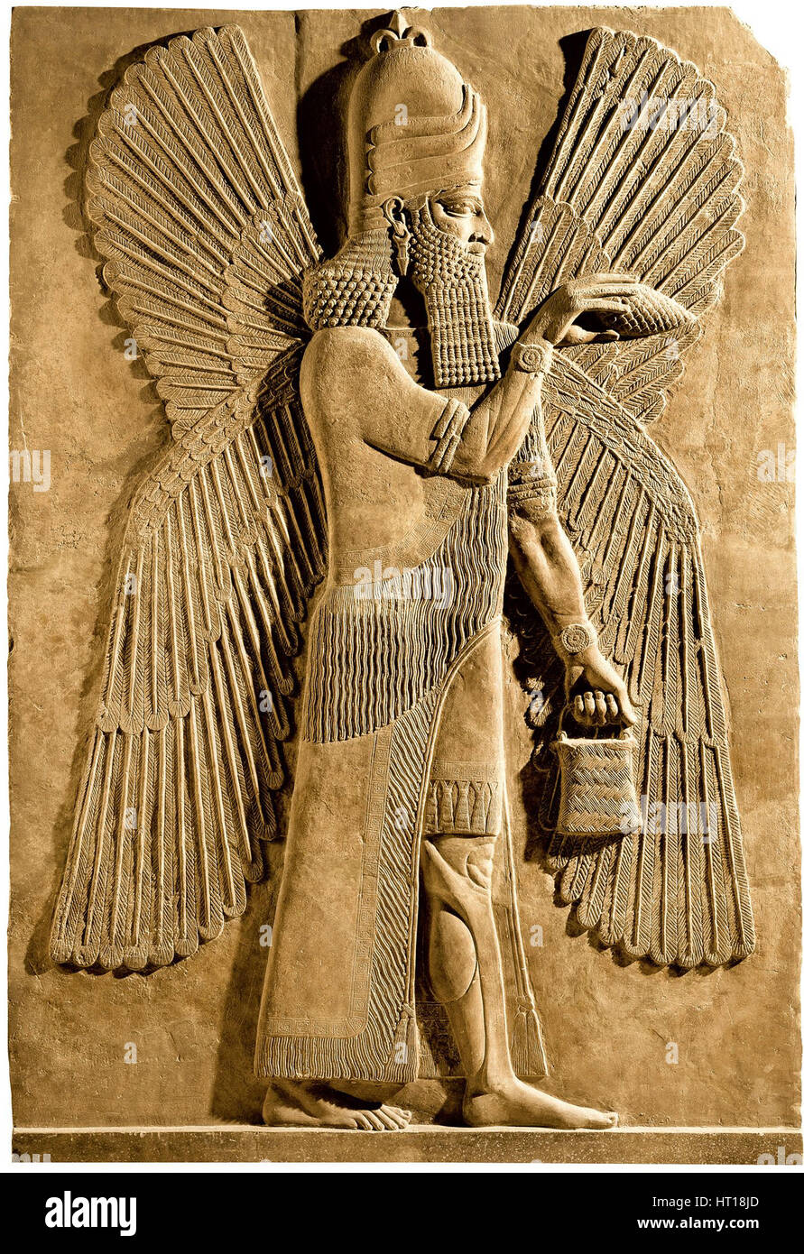 Winged genie. Detail of a relief from the palace of Assyrian king Sargon II, 722-705 BC. Artist: Assyrian Art Stock Photo
